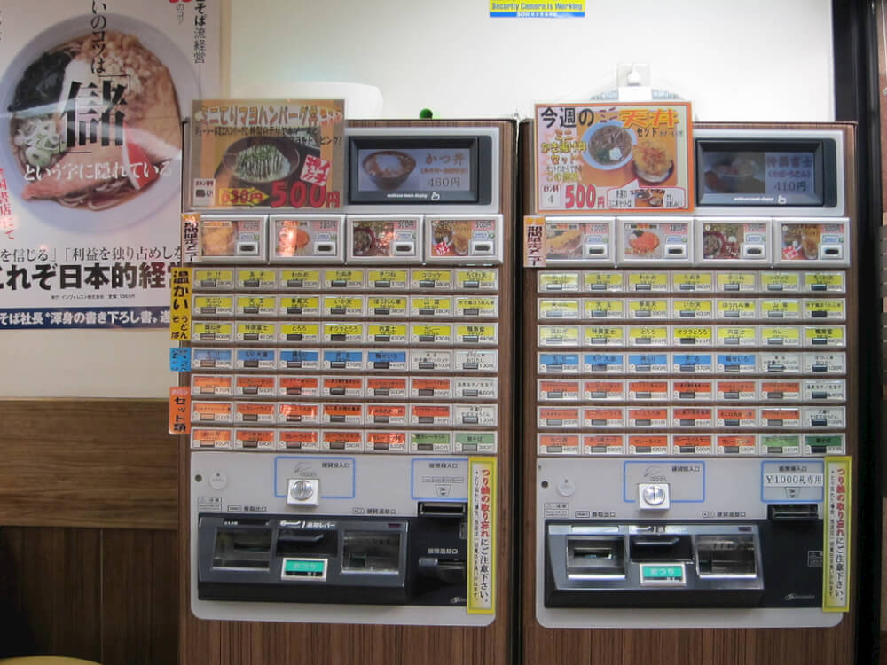 Meal ticket machines. Items are colour-coded for easy selection. Image courtesy of Cristina Bejarano (CC License)